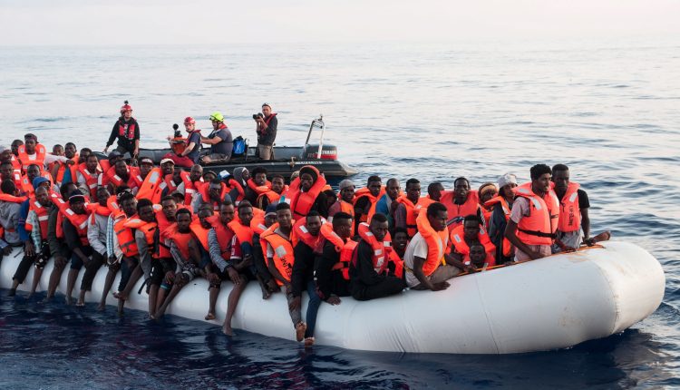 Varios inmigrantes rescatados en aguas internacionales del Mediterráneo a bordo del barco holandés Lifeline, el 21 de junio del 2018.